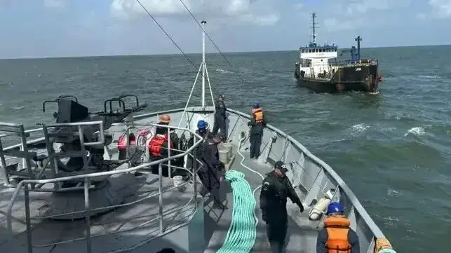 Just after the registration is changed and the flag is altered, the crew is left to 